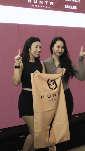 Two athletes sharing the sandbag