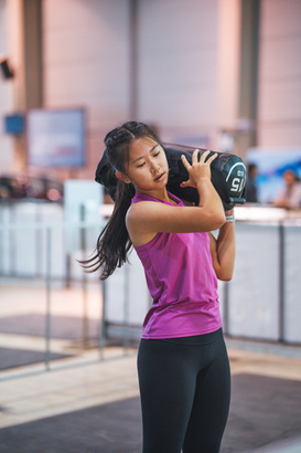 Athlete lifting the lightest sandbag