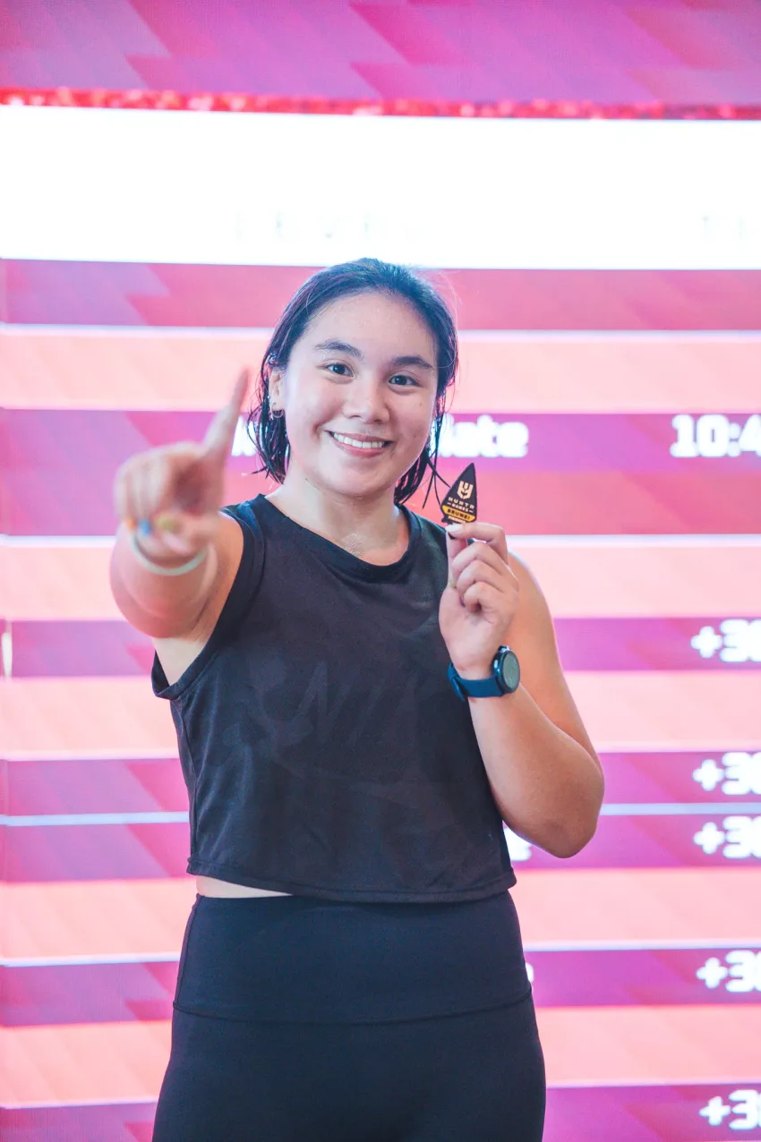 A HUNTR with her finisher patch