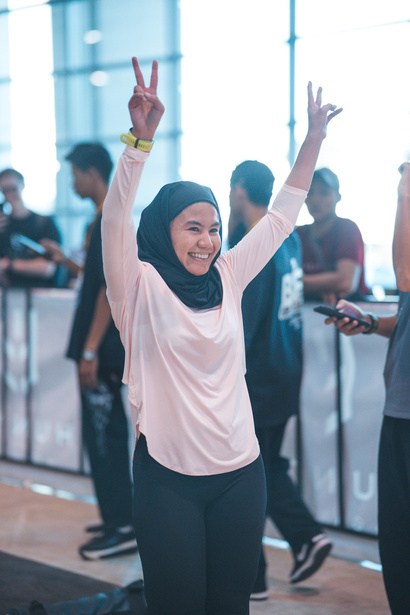A HUNTR celebrating her result